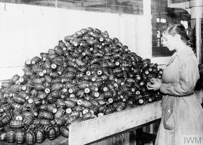 BritainsMilHist's tweet photo. A female munitions worker inspecting Mills hand grenades in a British factory during WW1. https://t.co/bUm3pOLaw4