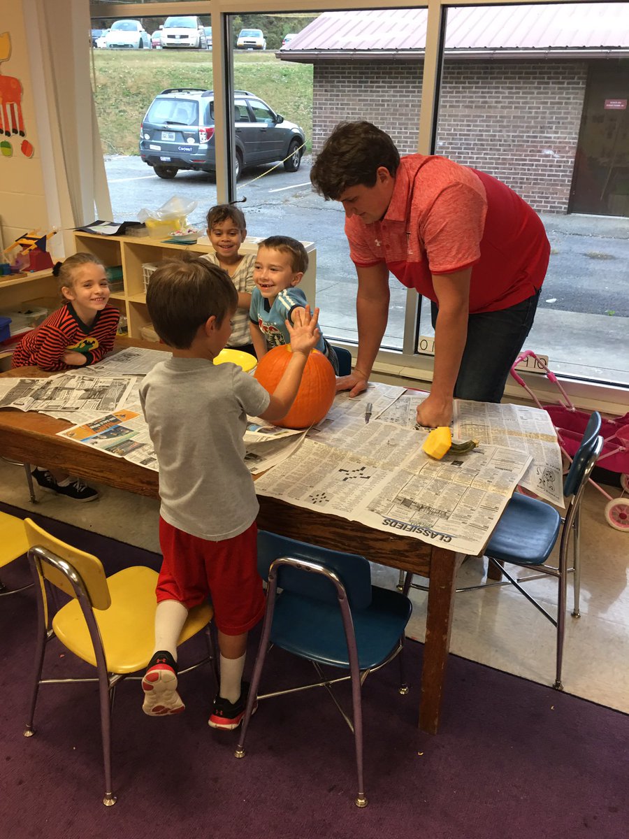 coachdanedamron's tweet photo. @UVaWise_FB players carving pumpkins at Norton Elementary School.  #cavsinthecommunity #keepdigging https://t.co/EkhFlfvJNN