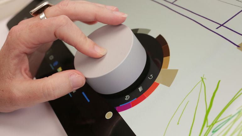 BridgetCarey's tweet photo. Microsoft has the Surface Dial. Apple has the Touch Bar. Both tools adapt to the software you're using. Are you #TeamPuck or #TeamStrip? https://t.co/xtEZtRLacZ