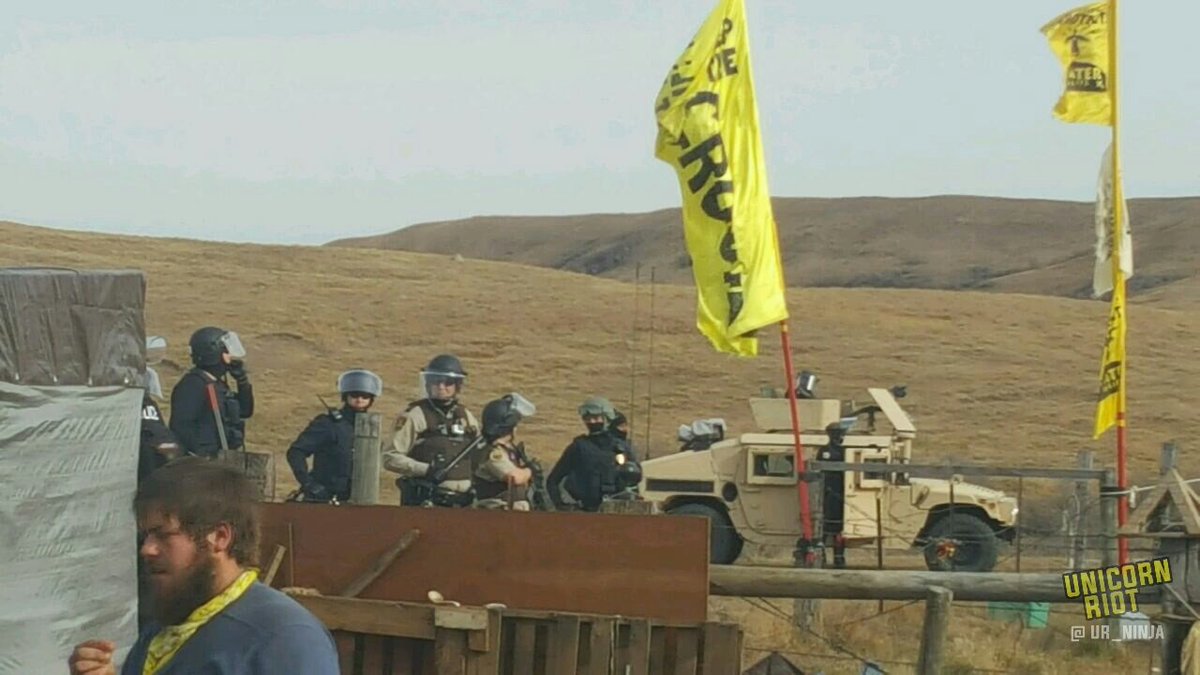 Police advance towards blockade on Hwy 1806 to evict #OcetiSakowin from 1851 treaty land and pave way for the #DakotaAccessPipeline. #NoDAPL