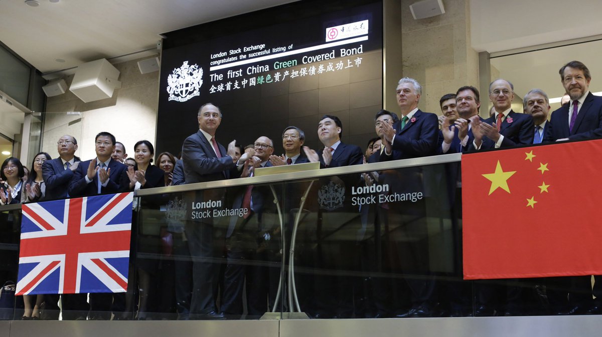 LSEplc's tweet photo. Bank of China lists 1st Chinese Green Covered Bond. Chairman Tian Guoli, Simon Kirby, Economic Secretary to the Treasury open trading https://t.co/Ae9iscw9iE