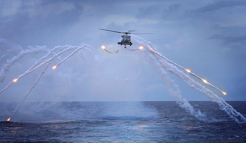 #POTD #HMASPerth's embarked MH-60R #helicopter firing flares on her way home from her #MiddleEast deployment