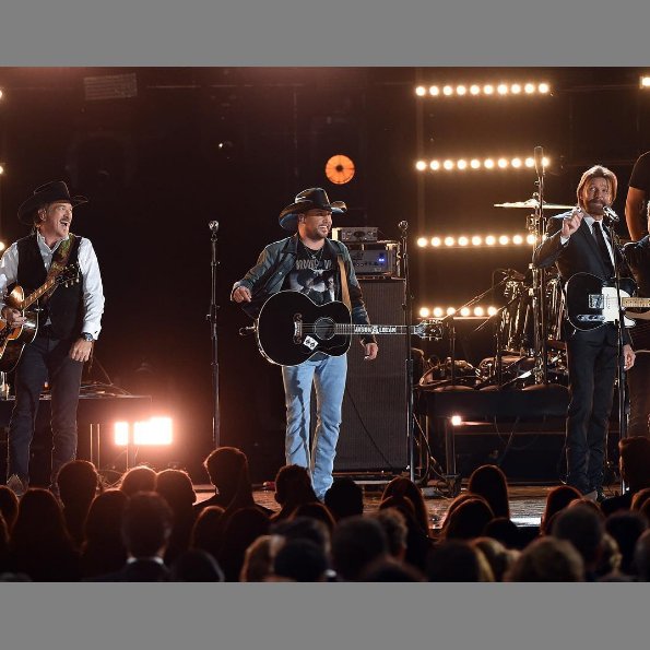 Jason_Aldean's tweet photo. So cool getting to perform with a couple of my musical heroes last week at the #CMAAwards50. #brooksanddunn 🎸 
photo cred: Rick Diamond https://t.co/4ec34hjlE1