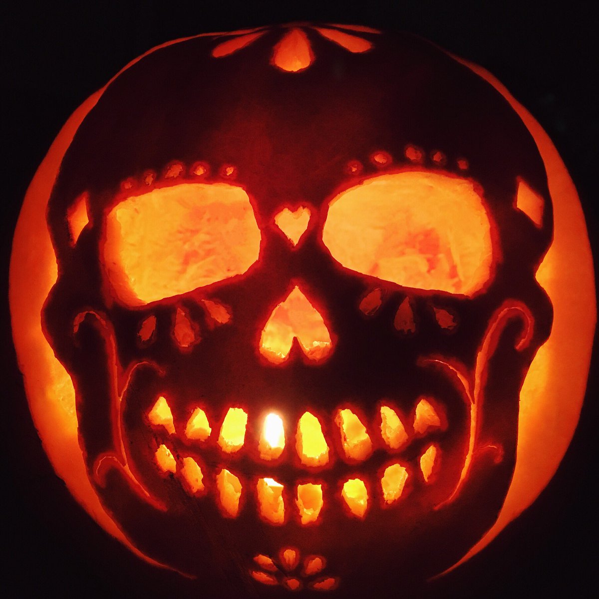 AnimeDoll's tweet photo. Forgot to share this before. My pumpkin celebrating the day of the dead #halloween #pumpkincarving #DayoftheDead https://t.co/tyOIzI8KzE