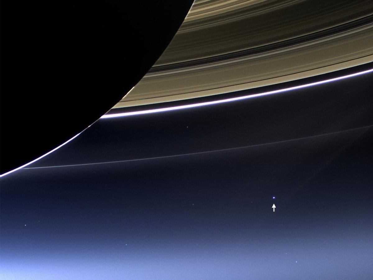 Astro_Wheels's tweet photo. Earth from Saturn: There we are...just a blue speck of dust in a sunbeam. Our existence improbable, our presence undetectable in the cosmos. https://t.co/Q4s4ppxM6o