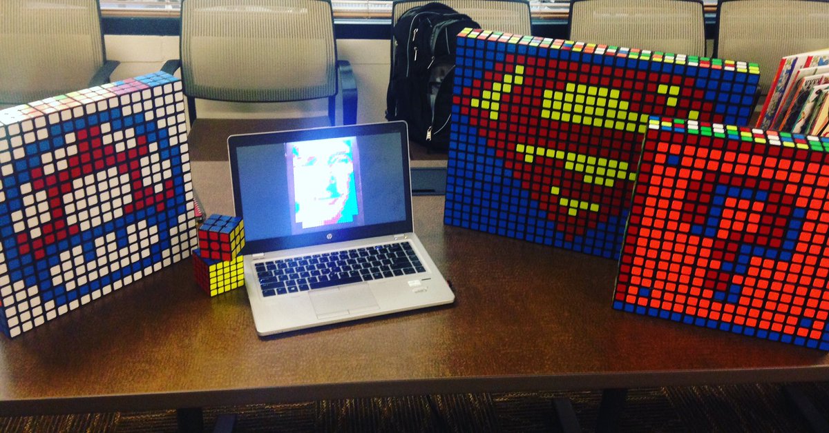 Pixelperspect8's tweet image. First craft fair. I'm the guy balling out between the lady WR hand knit sweaters and the lady with kids books! #cubes #cubeart #RubiksCube