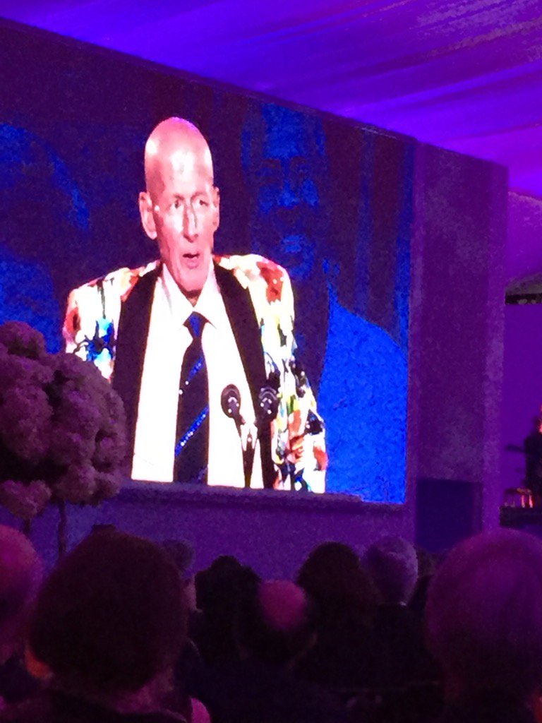 Craig Seger sportscaster talking at gala