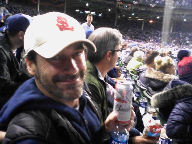 KMunie7's tweet image. I dare you to get more St. Louis than Jon Hamm sitting in Wrigley with a 1908 Cardinals hat on watching the Cubs lose while drinking a Bud.