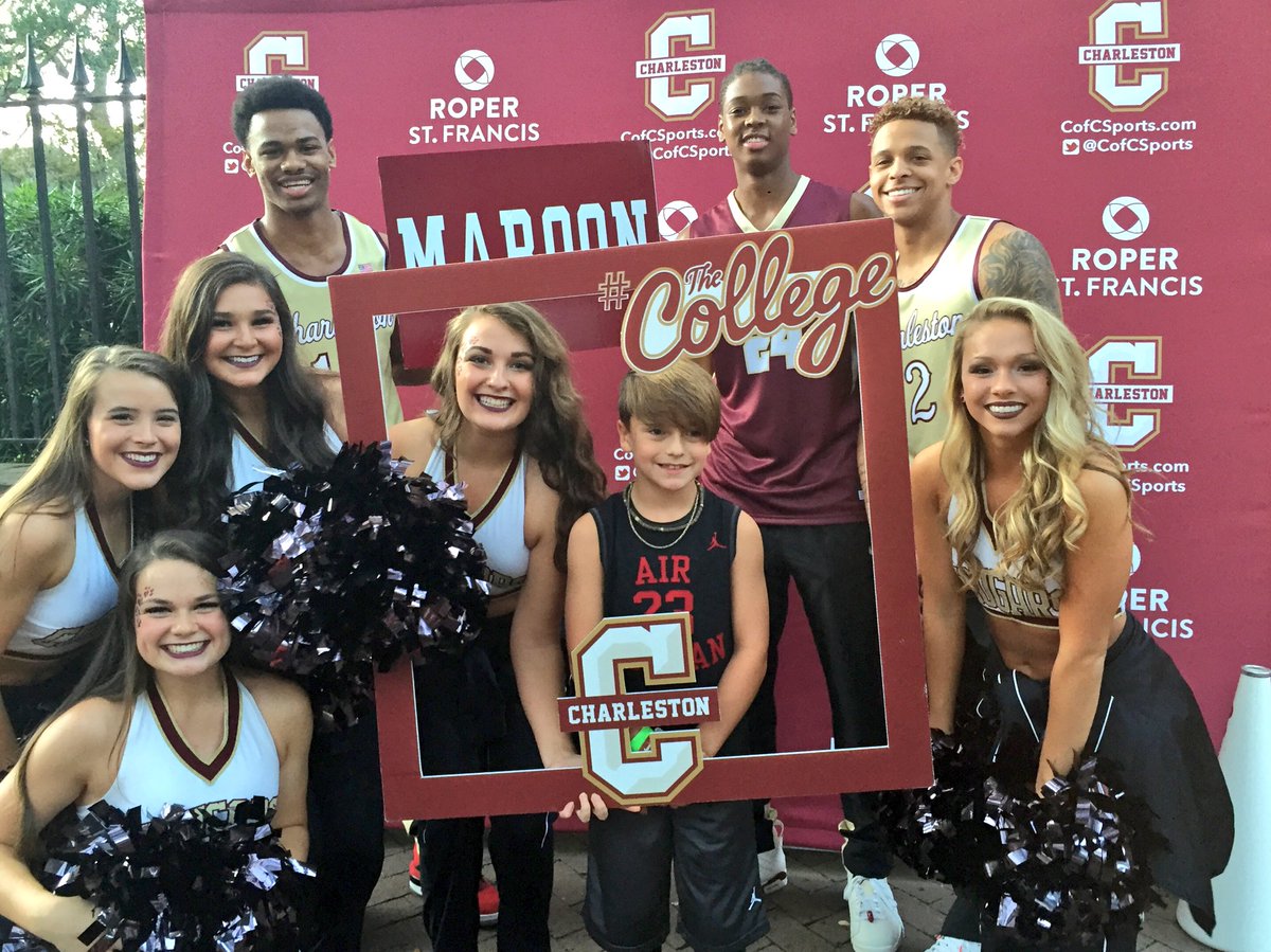CofCBasketball's tweet photo. @CofCBasketball and @CofCCougarettes photo op 📸 with one of the team's littlest fans at Charleston Basketball Block Party! #TheCollege https://t.co/ptgnwDvcRo