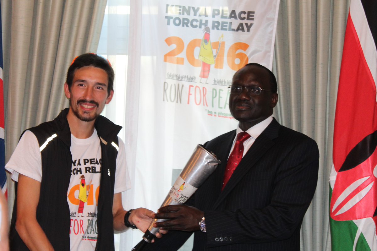 KenyaMissionUK's tweet photo. @tango5tavy presentsThe High Commissioner H.E Lazarus Amayo with the Kenya Peace Torch as part of  @Aegis_Trust  Run4Peace 2016 https://t.co/Bm59V7zdAH