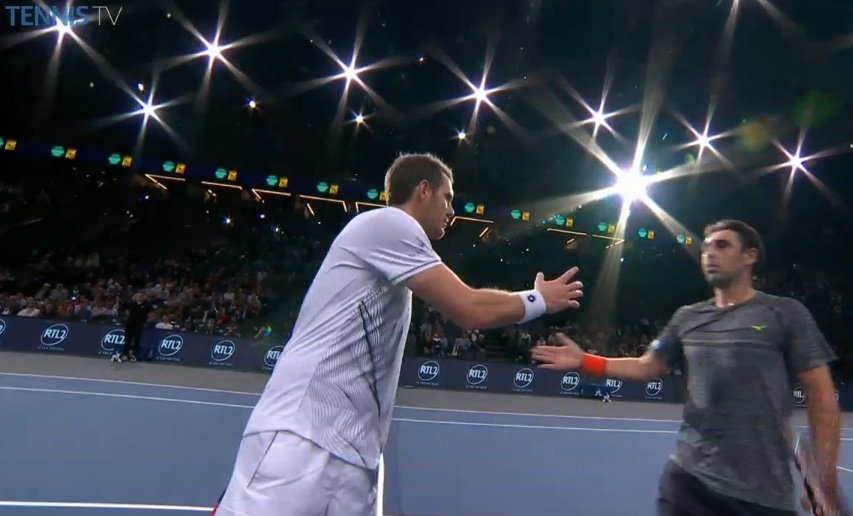 TennisTV's tweet photo. Despite a second-set comeback from #PHM, @marcosbaghdatis is into @bnppmasters R2 (and speaking to crowd in French!) https://t.co/kRsZ9udpkC https://t.co/fxf61SlRWy