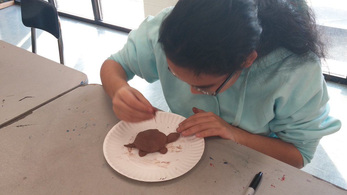 myrascox1's tweet photo. FHS student creates a turtle inspired by the spirit of clay under the instruction of Native American potter Senora Lynch @yadkincoschools https://t.co/snMfaQlDRS