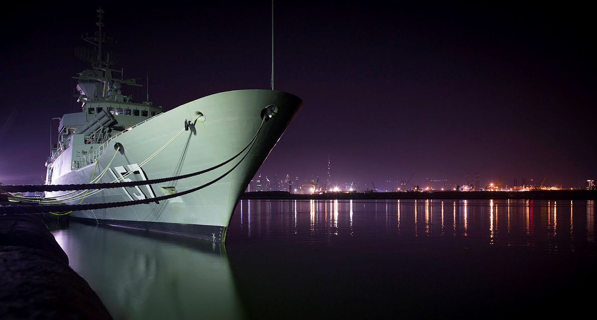 #HMASPerth is backlit by Dubai during a port visit as part of her deployment on Operation Manitou @Australian_Navy #YourADF