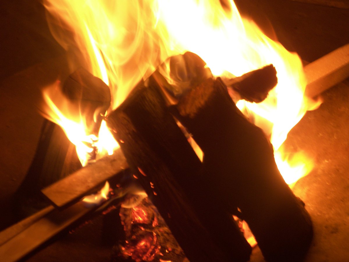 Travellers chilling over a braai and wine, a roaring fire and story-telling of local culture and legend. #Ladismith24 #KeepTheFireBurning