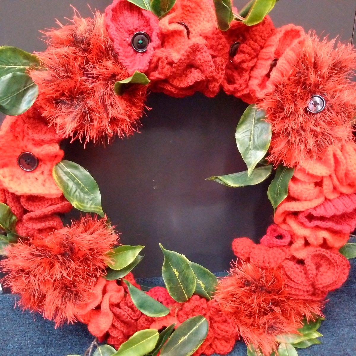 LibrariesNL's tweet photo. #RemembranceDay wreath (knitted by our lovely #KnittingBee) is ready & about to be put up over the front door at Motherwell Library https://t.co/gH0W6c7N5e
