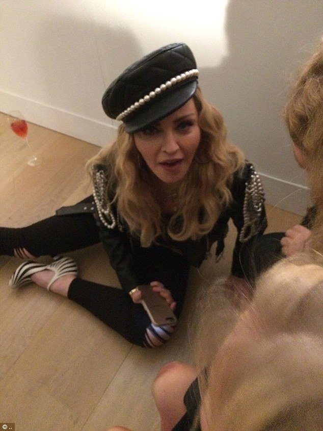 DailyMailCeleb's tweet photo. Madonna, 58, rolls around on the floor at a prestigious photography exhibition in London https://t.co/mCgvVsJLrc https://t.co/Hbb68uC0dG