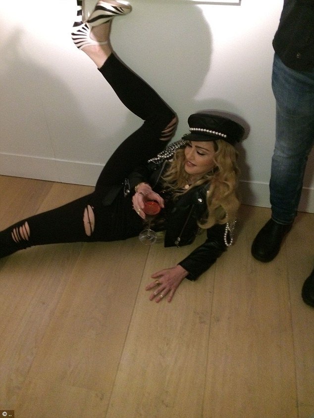 DailyMailCeleb's tweet photo. Madonna, 58, rolls around on the floor at a prestigious photography exhibition in London https://t.co/mCgvVsJLrc https://t.co/Hbb68uC0dG