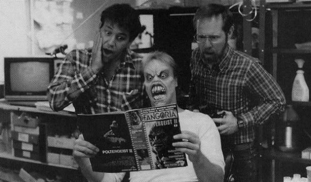 Sam Raimi and Richard Domeier reading Fangoria on the set of Evil Dead II (1987).