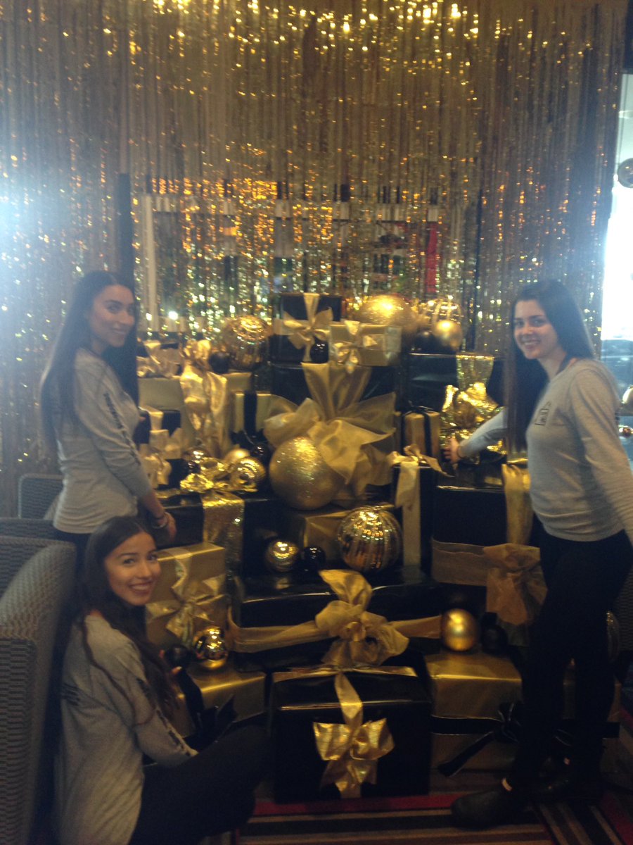 WinterFestival's tweet photo. Interior Design students from @humbercollege behind the scenes of their Gold Luxury theme decor. #DecktheFalls #WFOLlive #SpiritNiagara https://t.co/NwTc3EdYlA