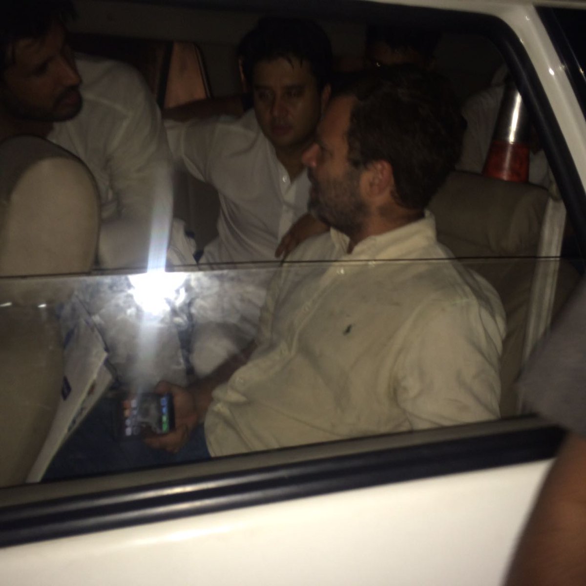 INCIndia's tweet photo. Rahul Gandhi detained by Delhi Police. He is in a police vehicle at 5 Firozeshah Road. https://t.co/ISES7UEgrZ