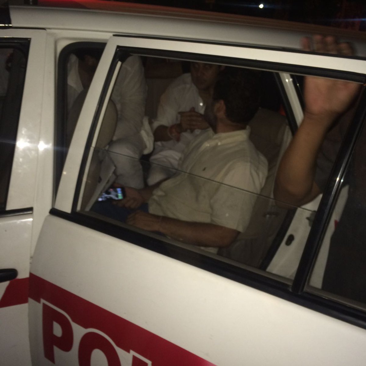INCIndia's tweet photo. Rahul Gandhi detained by Delhi Police. He is in a police vehicle at 5 Firozeshah Road. https://t.co/ISES7UEgrZ