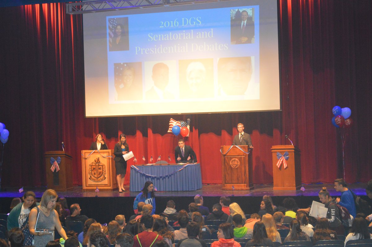 Dist_99's tweet photo. Before all-school mock election, @DownersSouth students present mock debates, educate others on issues #DGSPride https://t.co/pTvpCzmgVv https://t.co/v9IJsnP9rm