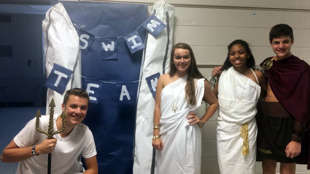 EagleSwimming's tweet photo. #EliteEagles Swimmers greeted 600+ kids during @AirportHS's annual #TrickOrTreatLane! 🎃 Swim season may be over, but swimfam is forever. 💙 https://t.co/d0x5ukC9yX