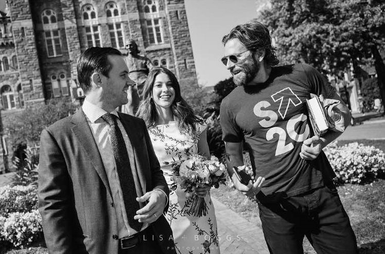 GUAlumni's tweet photo. "Black tie optional, right?" @Georgetown grad Bradley Cooper (C'97) photobombs #Hoya newlyweds! #OnlyAtGeorgetown #TBT 📷: @lisaboggsphoto https://t.co/L1Vhmr9m1U
