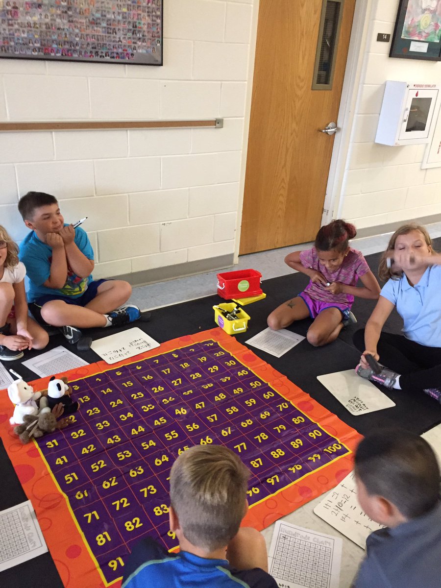 LauraGage4's tweet photo. Isn't math always more fun with a life-sized 100s grid game board?! @HoffmanTrailsEl https://t.co/41F7isLpRy