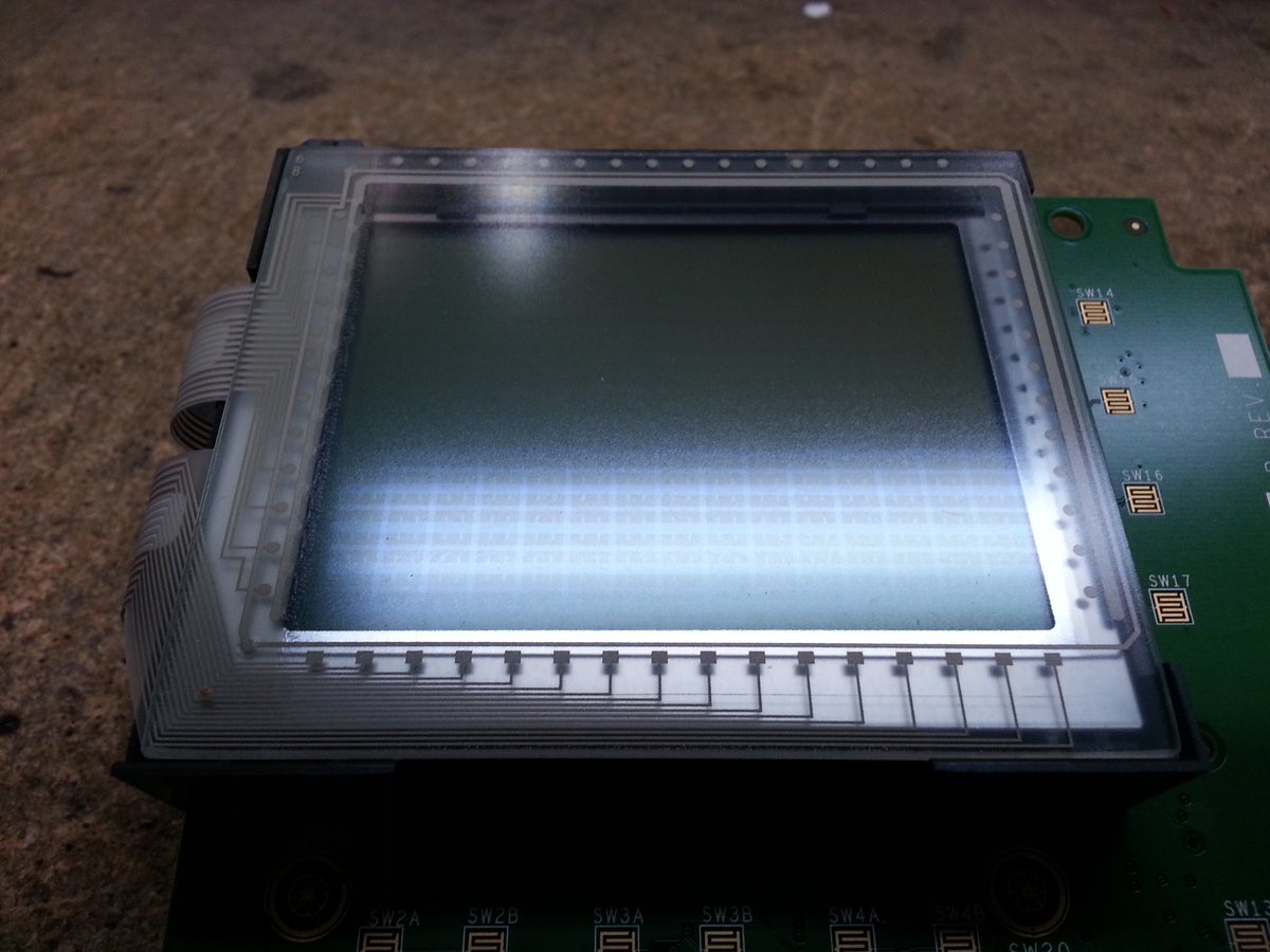 Valenthorpe's tweet photo. Credit card touch screen. You can see the indium tin oxide conductors in the glare of the light. #CuriousDragon https://t.co/vKOheAHT2K