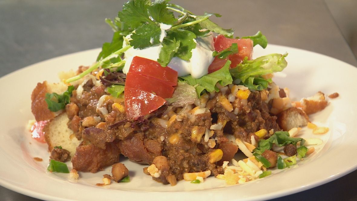 CBCToronto's tweet photo. There's deep-fried bannock beneath that mound of chili, cheese and sour cream https://t.co/p89si82tg3 https://t.co/rPHbYPtBk6