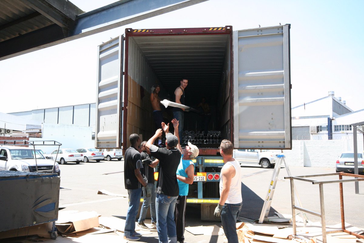 ACScreens_SA's tweet photo. AC Screens Guys hard at work on a Friday afternoon off loading another container, just in time for the Christmas rush! https://t.co/RePRgtAQoW