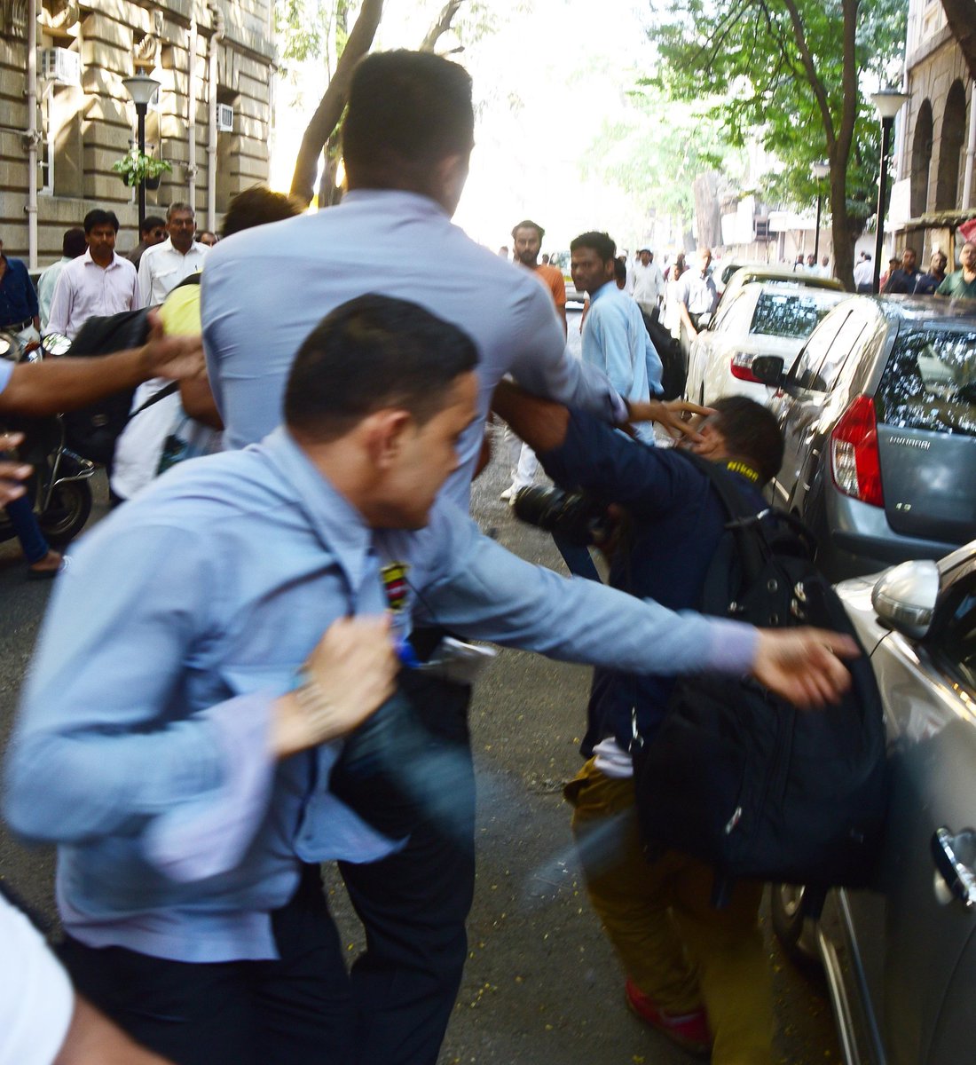 thisisindra's tweet photo. Brutal assault on #photojournalists outside @TataCompanies HQ by security. @RNTata2000 #Shame https://t.co/MJ3VD9a0ur