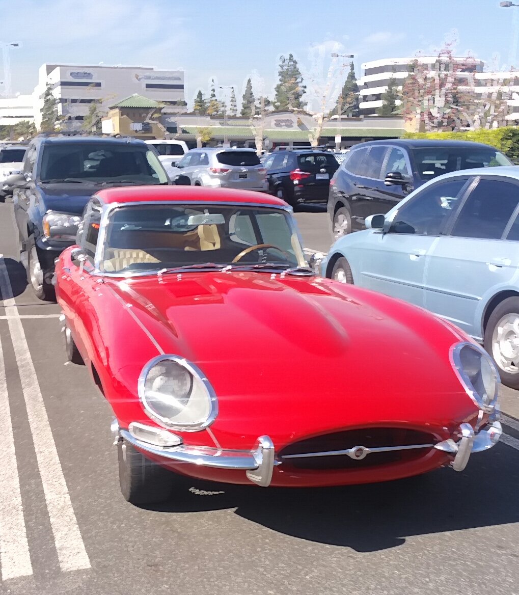 Nice Jaguar E type in the parking lot.
