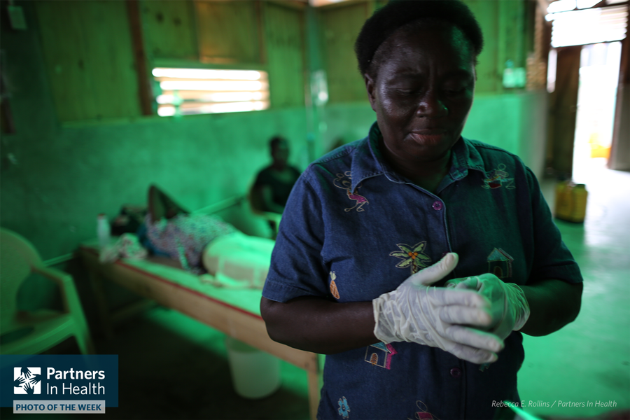 PIH's tweet photo. PHOTO OF THE WEEK: Platel Clesdennes Clercidor helps care for her parents at a PIH-supported cholera treatment center in Les Cayes, Haiti. https://t.co/foLGYIDRhX