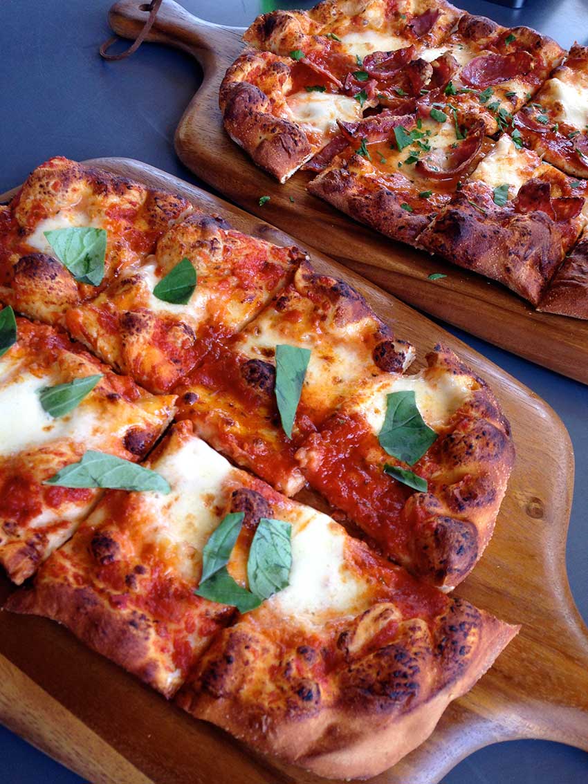 Pizza for days. Our best selling Margherita is a classic - Thin crust, hand stretched with roma tomato, fresh mozzarella &amp; basil.