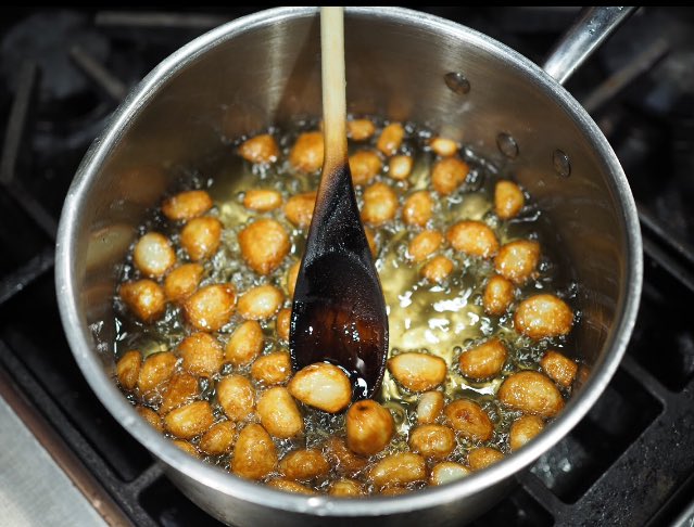 A close-up shot of  Confit Garlic!  #yeg #yegfood #chefbandito #popup #comalyeg.