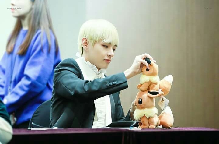 debcombo's tweet photo. taehyung is such a child playing with his plushies so precious i want to protect him at all costs 😍😭💜 https://t.co/D1fEE3uenf