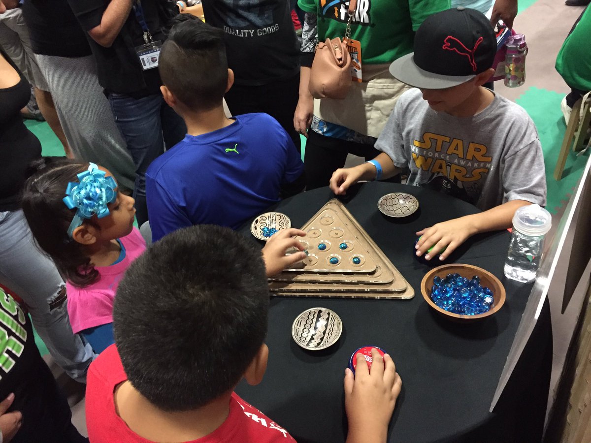 JeffSchoolNews's tweet photo. Playing tarumbeta, a math game requiring reasoning with a triangular arrangement of numbers #stmathfair https://t.co/w6xfc9ukS6
