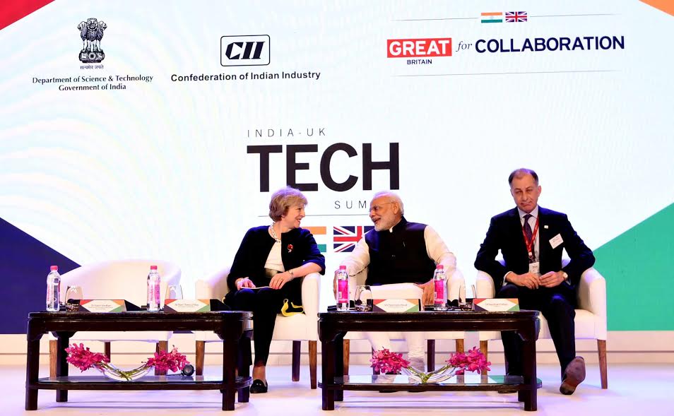 PIB_India's tweet photo. PM @narendramodi and UK PM Rt. Hon. @theresa_may at the #IndiaUK Tech Summit in Delhi https://t.co/yjvfDKcxbZ