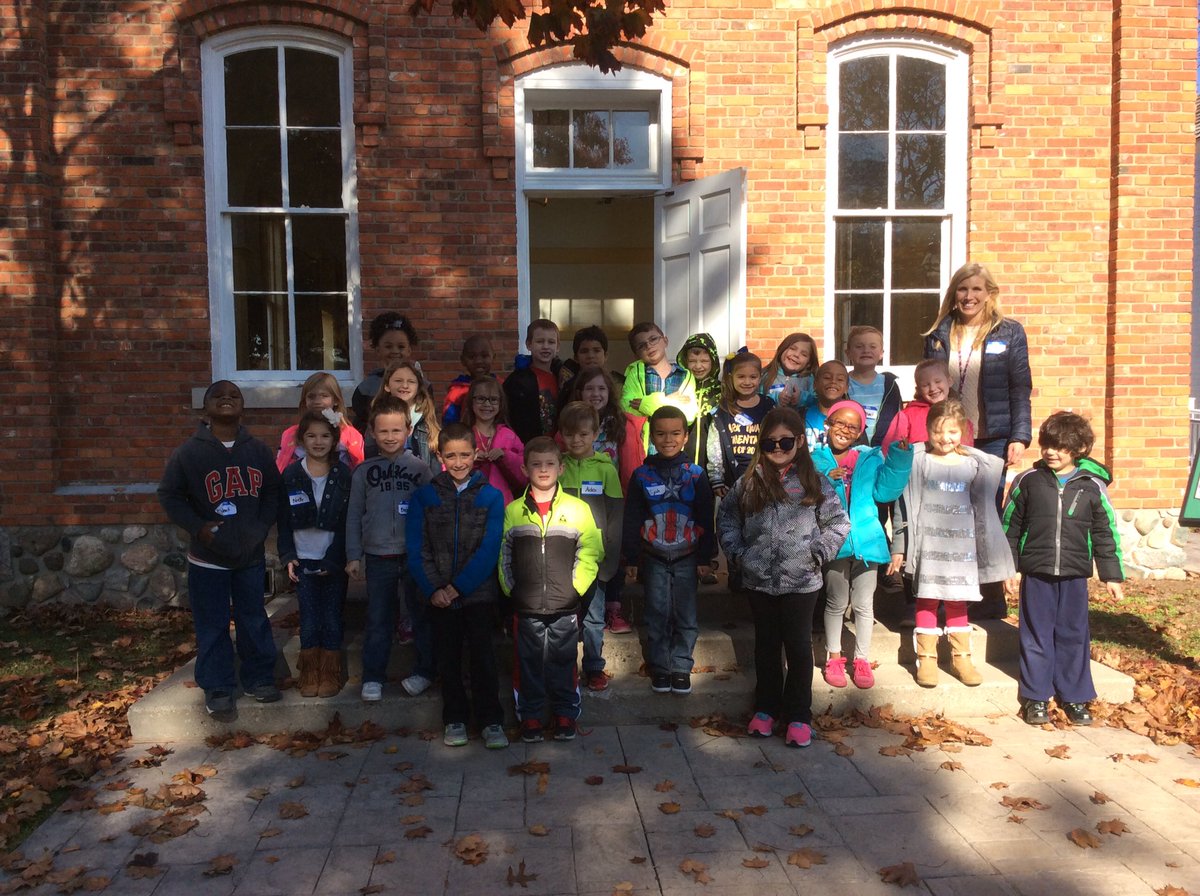1st graders outside the Poppleton 1 Room Schoolhouse at the Troy Historical Village.