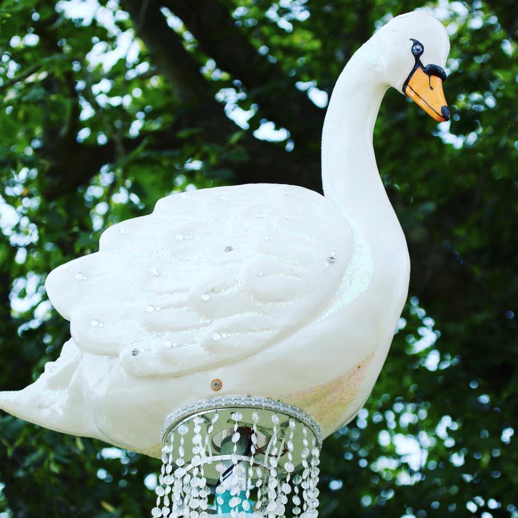 Up close with our elegant Swan Chandeliers #props #chandelier #lights #festival