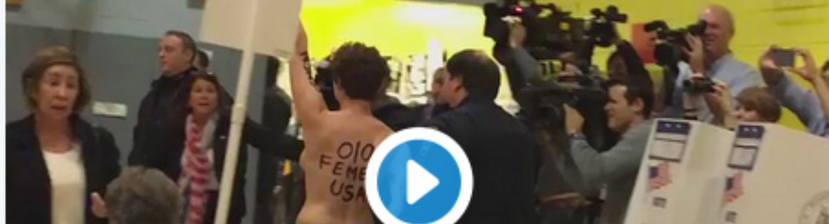 RebelNewsOnline's tweet photo. CAUGHT ON CAMERA: Topless woman from Montreal storms NY polling station to protest #Trump https://t.co/PxxHzG3pUN | #Election2016 #tcot https://t.co/M80RunzGoL