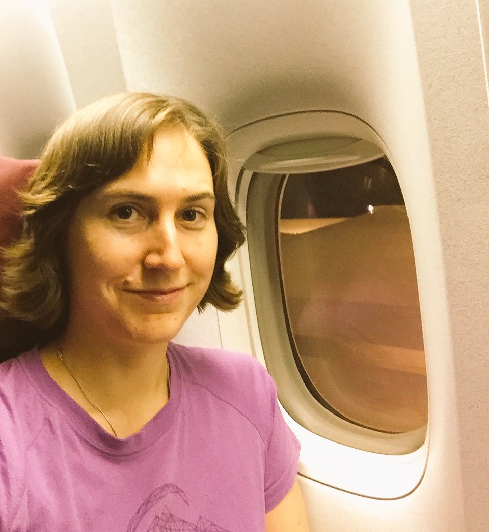 Me on the airplane looking tired 😕