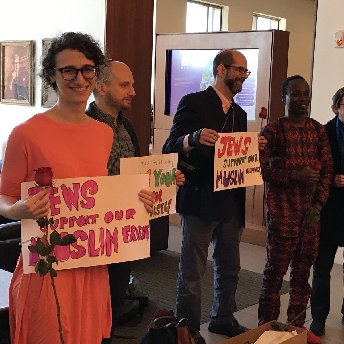 Our #Jewish friends in the NYU community giving out roses to #muslims to show their support! #LoveTrumpsHate