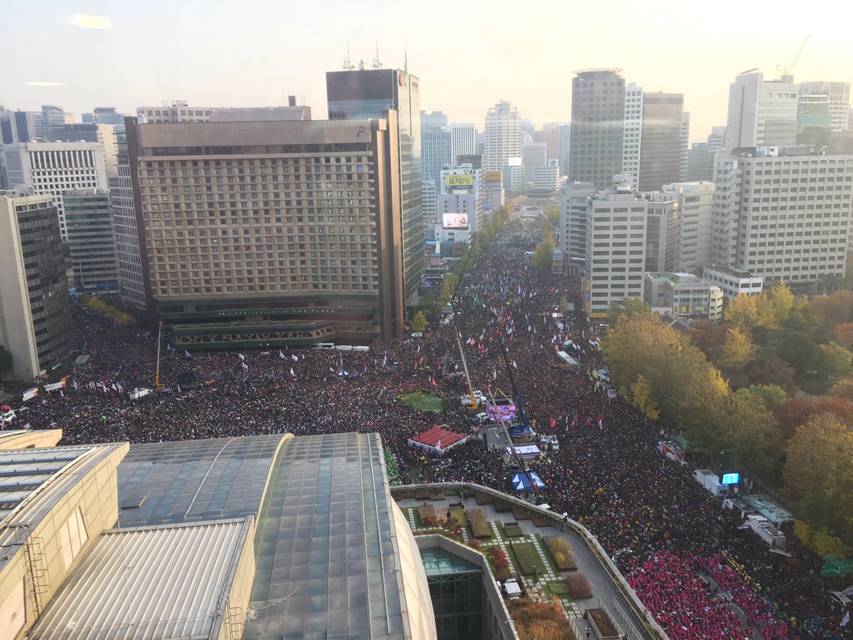 annafifield's tweet image. South Korea: The view from the foreign correspondents' club in Seoul. Officially half an hour into the protest and the streets are packed.