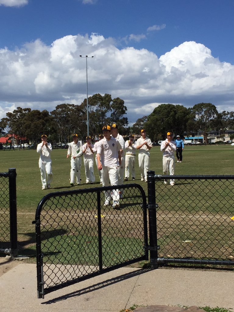 16 year old debutante Mitch Perry leads the boys off after taking 5 wickets including a wicket with his 1st ball