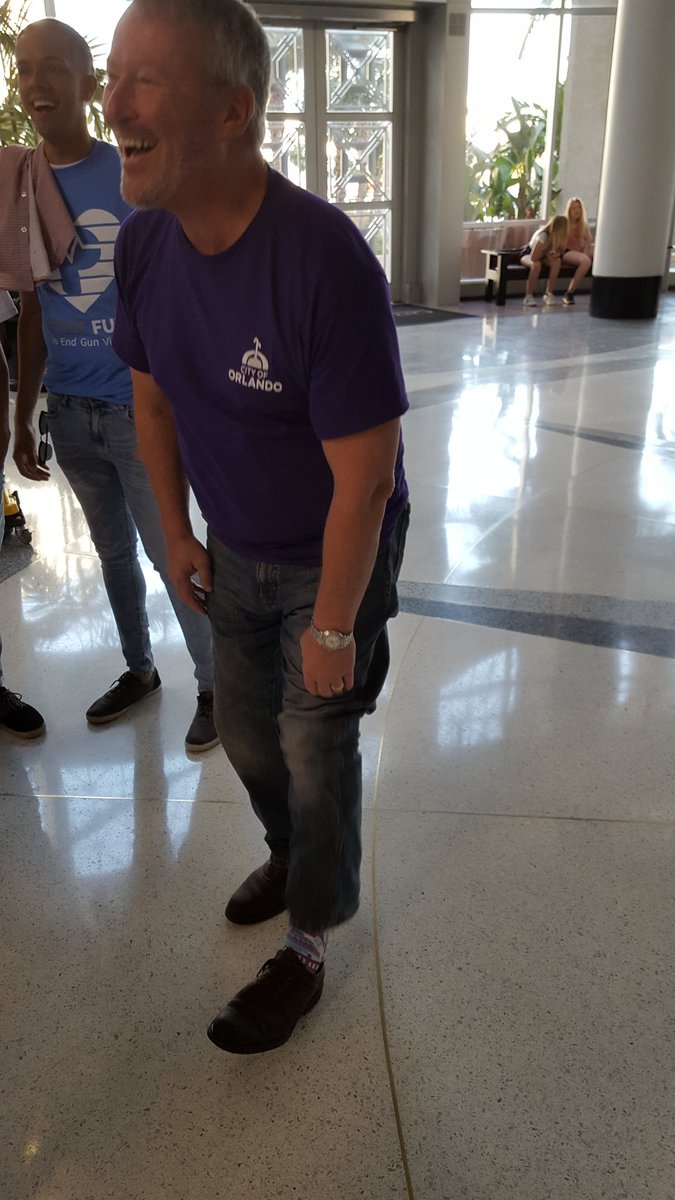 orlandomayor's tweet photo. Getting ready for the @OrlandoPride parade. The perfect day to wear my @RockEmApparel #OrlandoUnited socks. https://t.co/NnBwVi8CQX