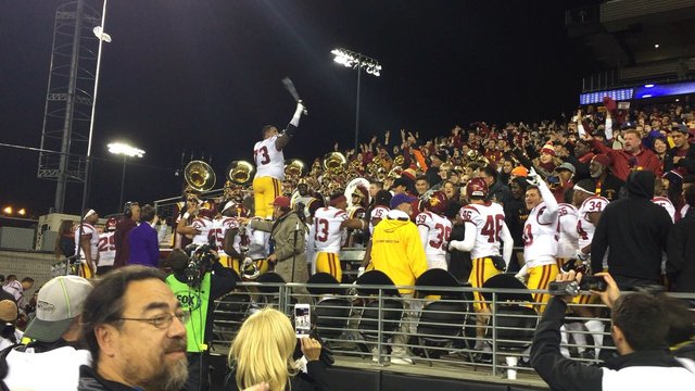 ESPNRittenberg's tweet photo. The swag is back. USC's Zach Banner, all 6-foot-9 of him, conducts the band after the... https://t.co/fkMccTO1NL https://t.co/GCu0VkWQq7