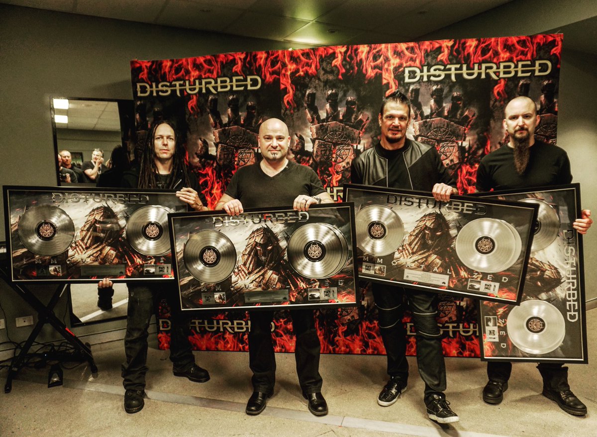 Disturbed's tweet photo. Thanks Australian #disturbedones ! "Immortalized" is Platinum &amp; our single "Sound Of Silence" is 2X Platinum down under!#DisturbedTour2016 https://t.co/fzl4qJMNrz